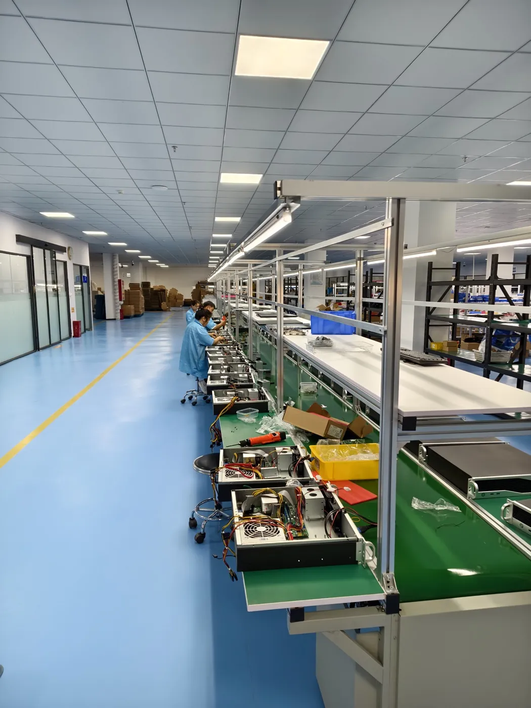 IPCtech assembly line workers building industrial computers in the factory